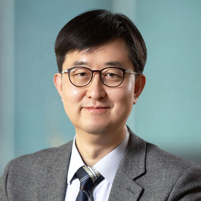 Headshot of Hyun Choi smiling at the camera.